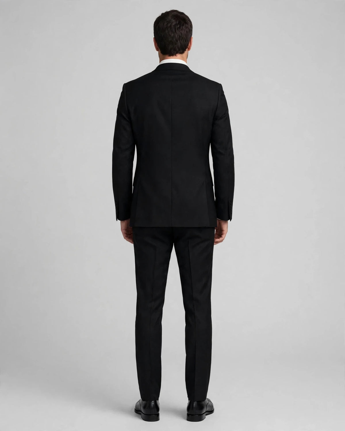 Black men's three-piece suit — model back view