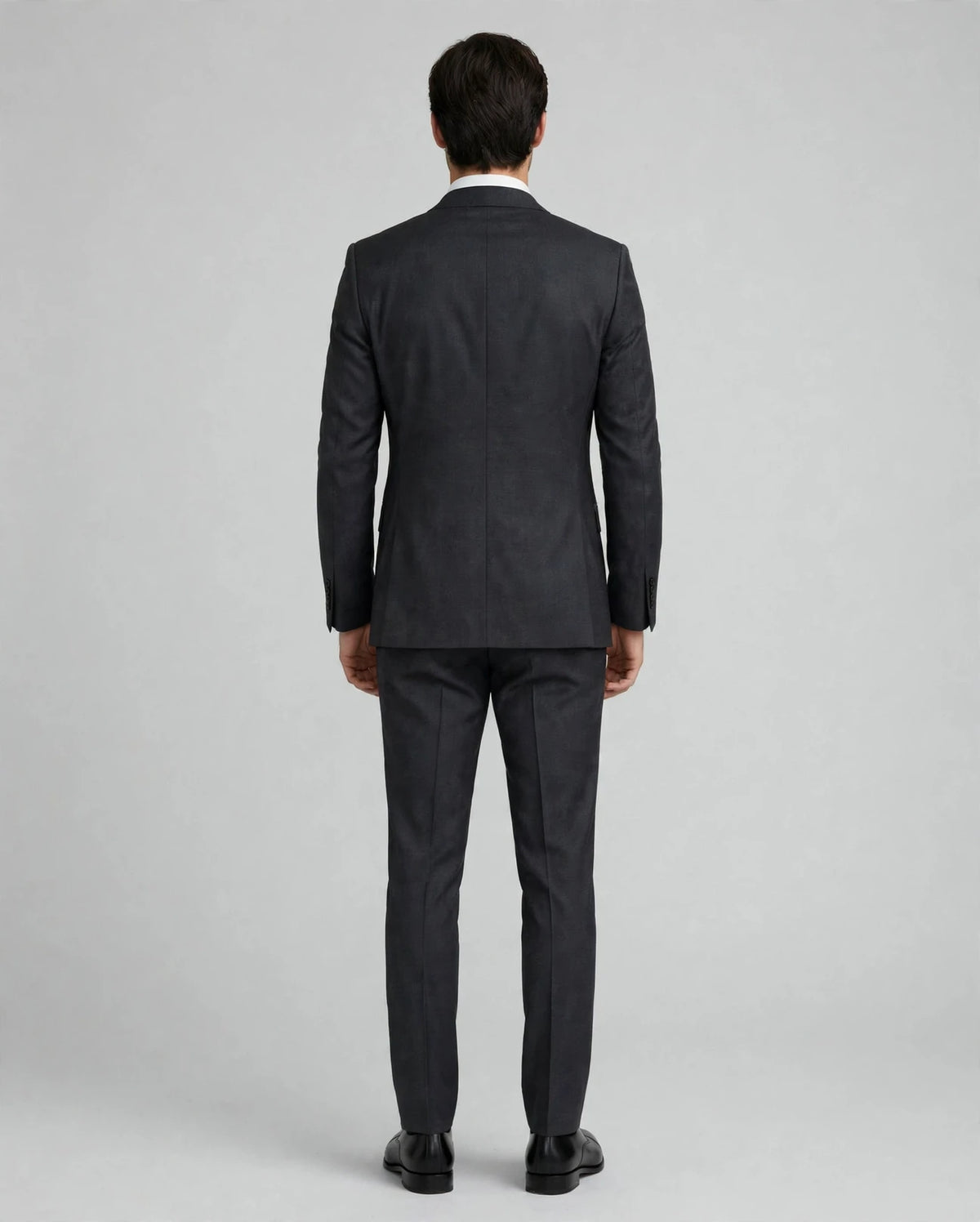 Charcoal Grey men's three-piece suit — model back view