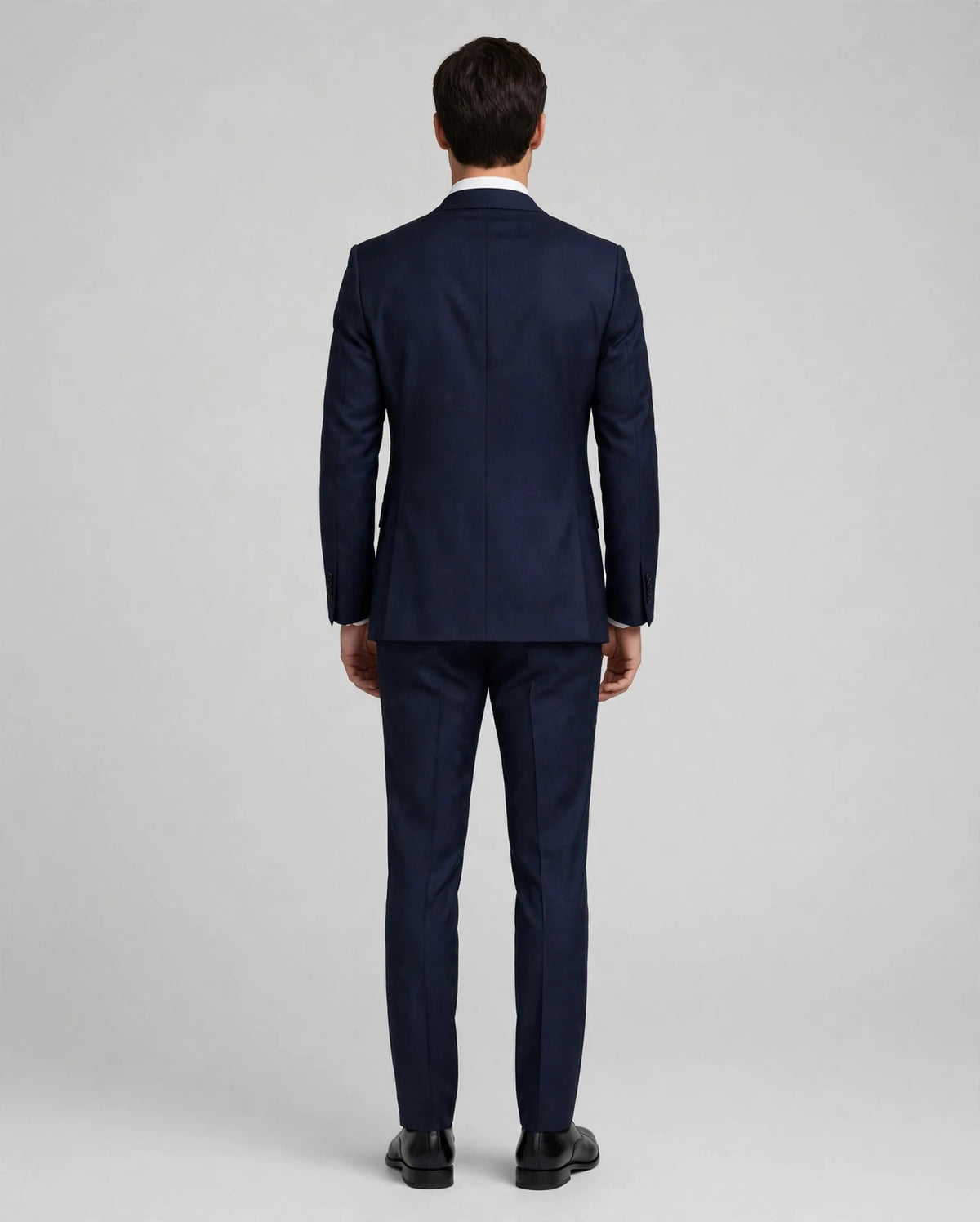 Navy Blue men's three-piece suit — model back view