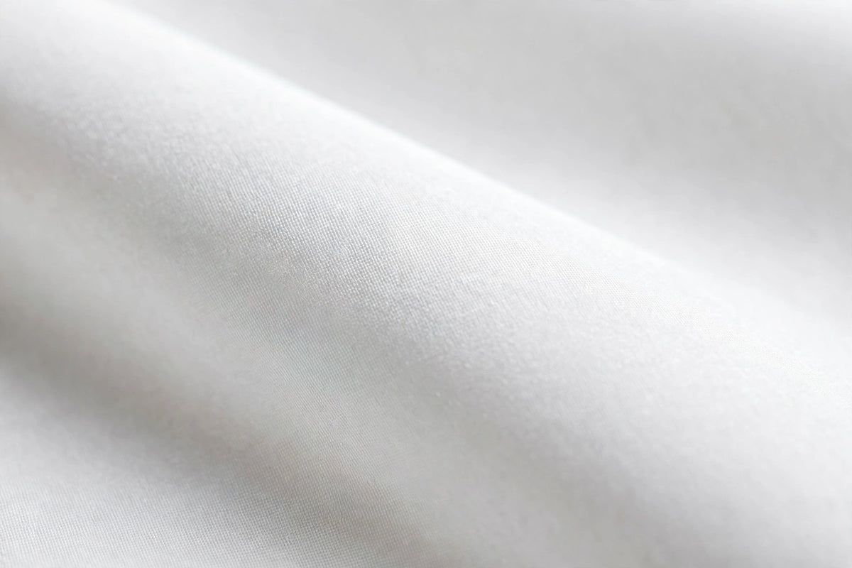 Close-up of fine white shirting fabric