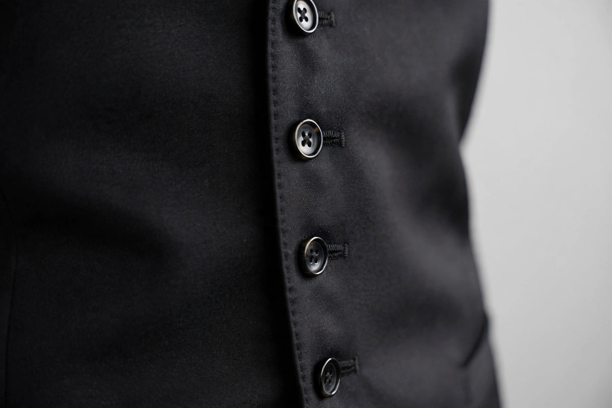 Black men's vest — button detail