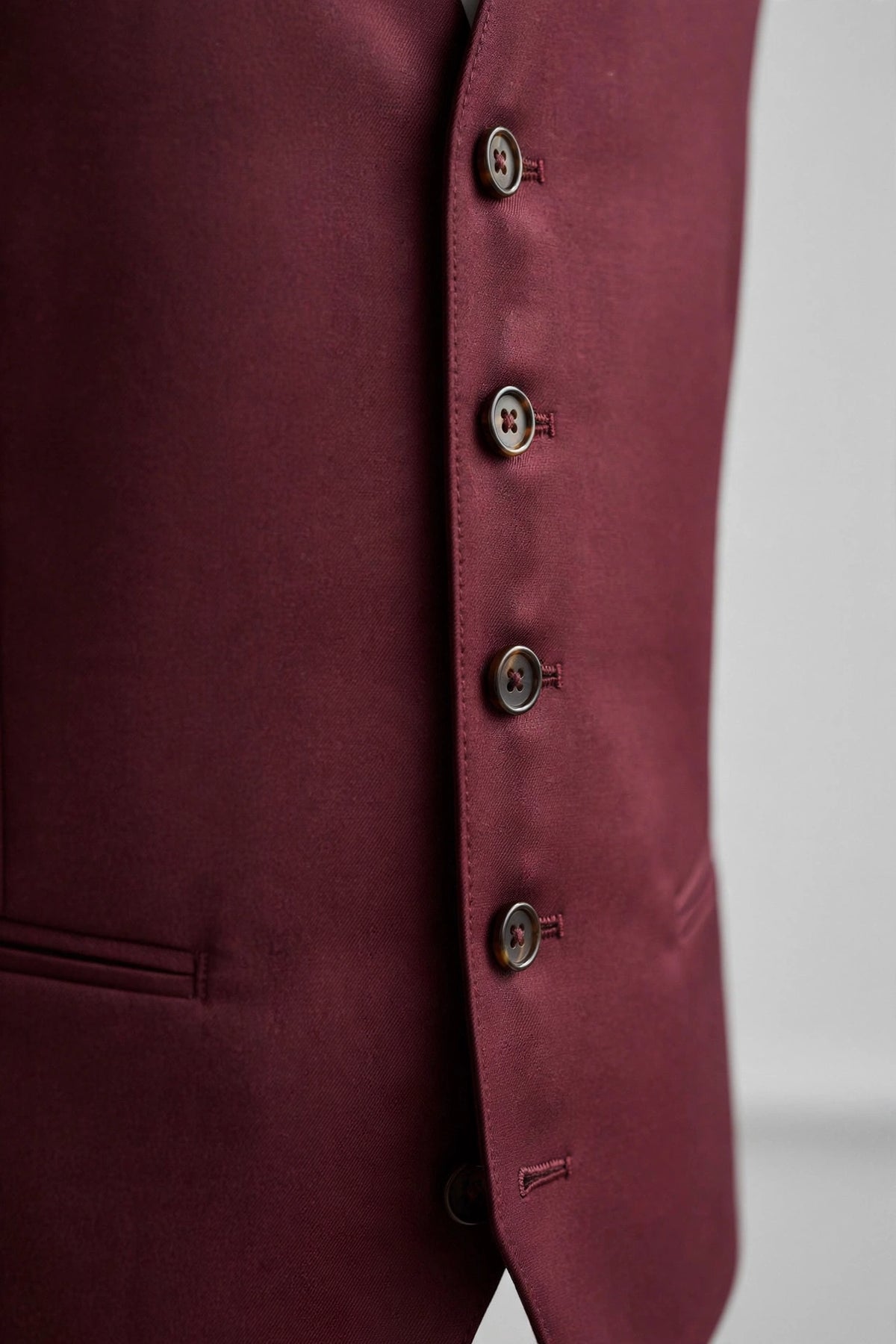 Burgundy men's vest — button detail