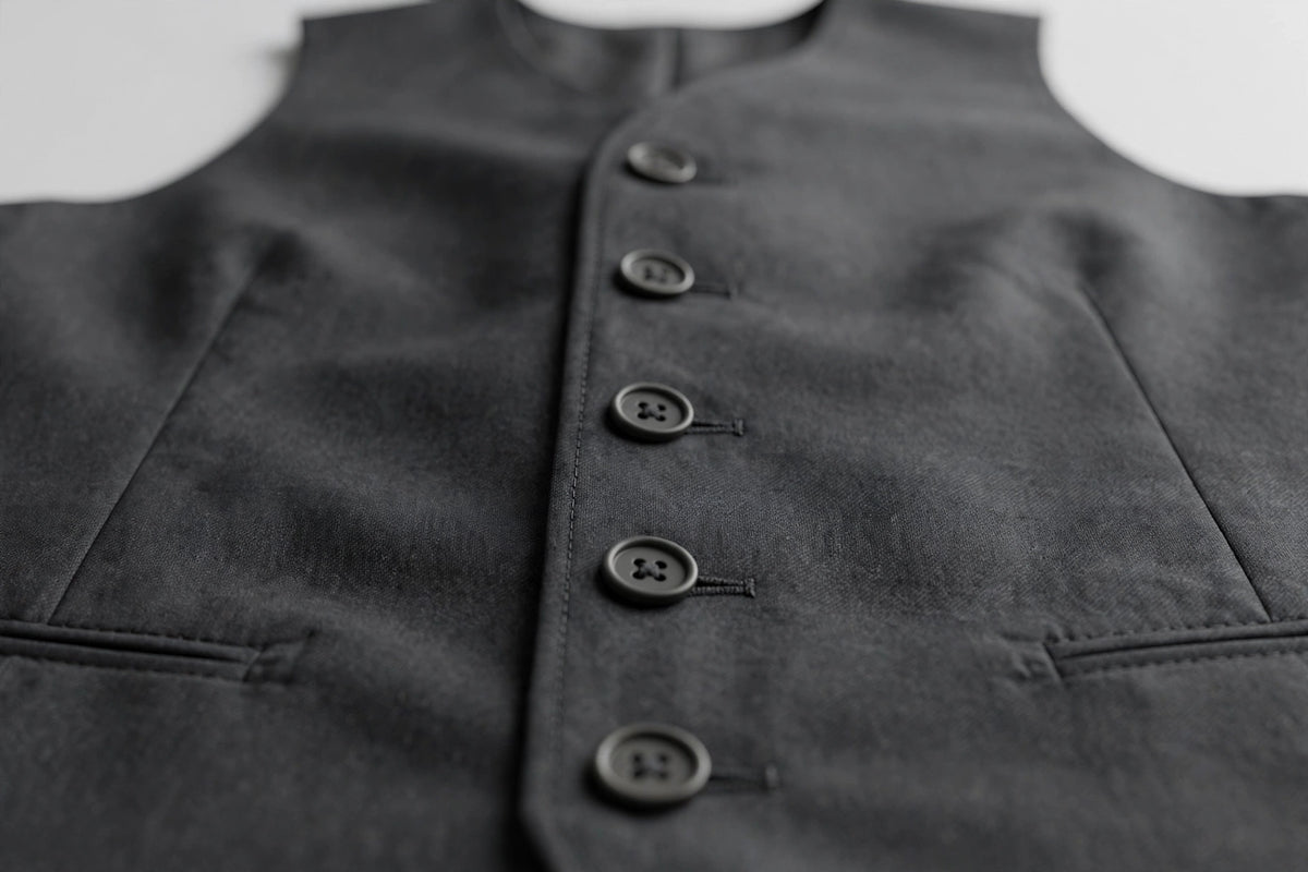 Charcoal Grey men's vest — button detail